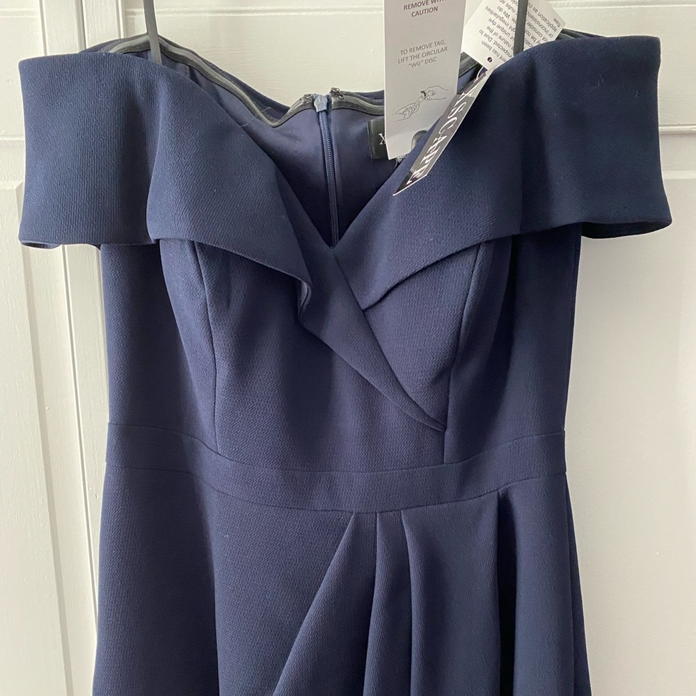 New with tags Xscape Lord and Taylor navy off the shoulder dress. Size 8.